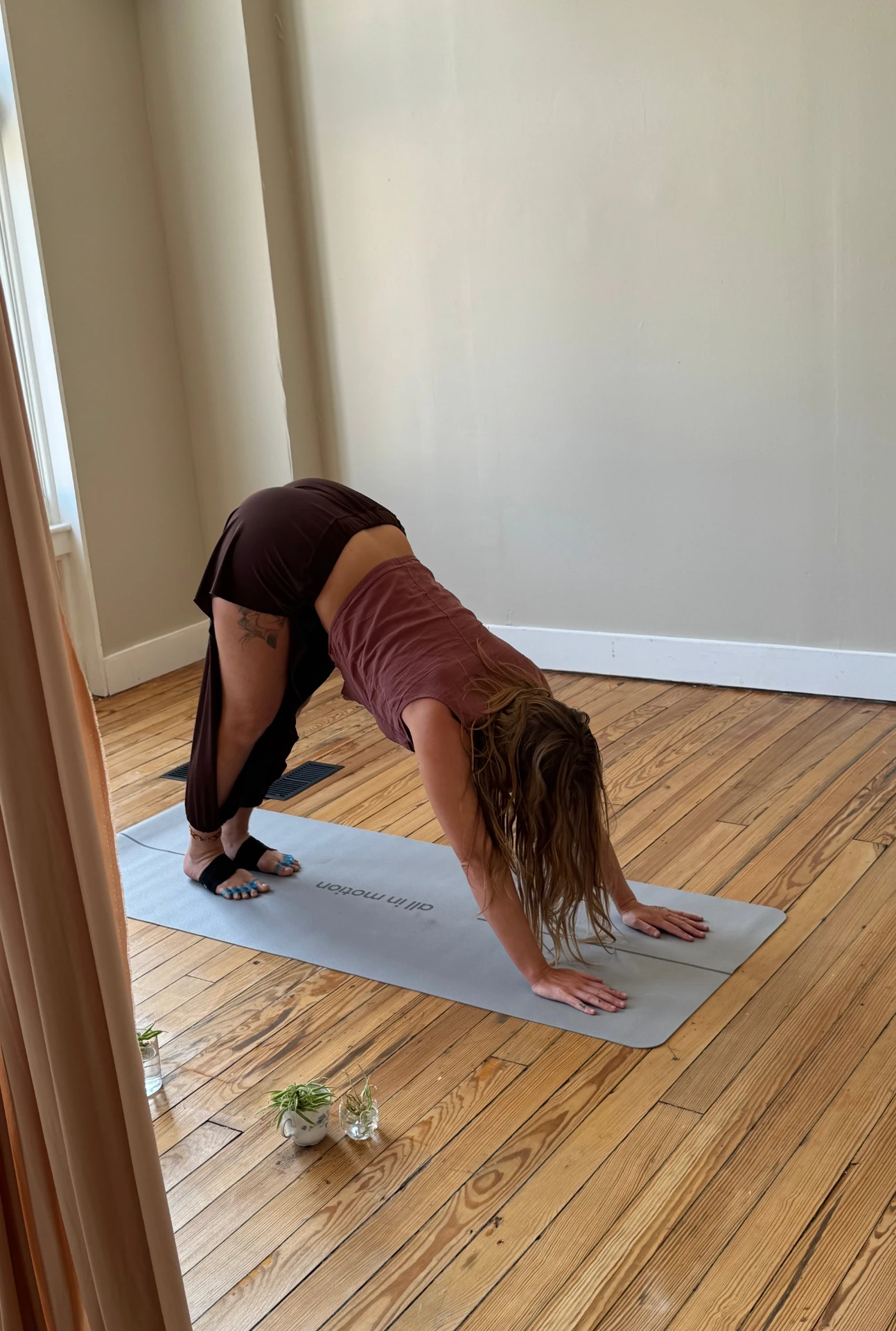 Michele Gaddis practicing downward dog in the North Hampton studio